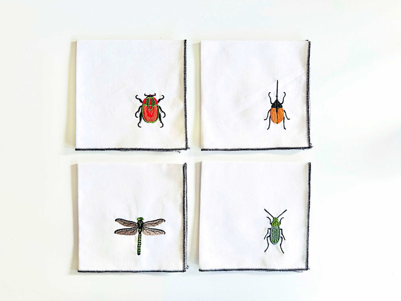 https://www.dotandarmy.com/cdn/shop/files/new_embroidered_insect_napkins_800x.jpg?v=1703335275
